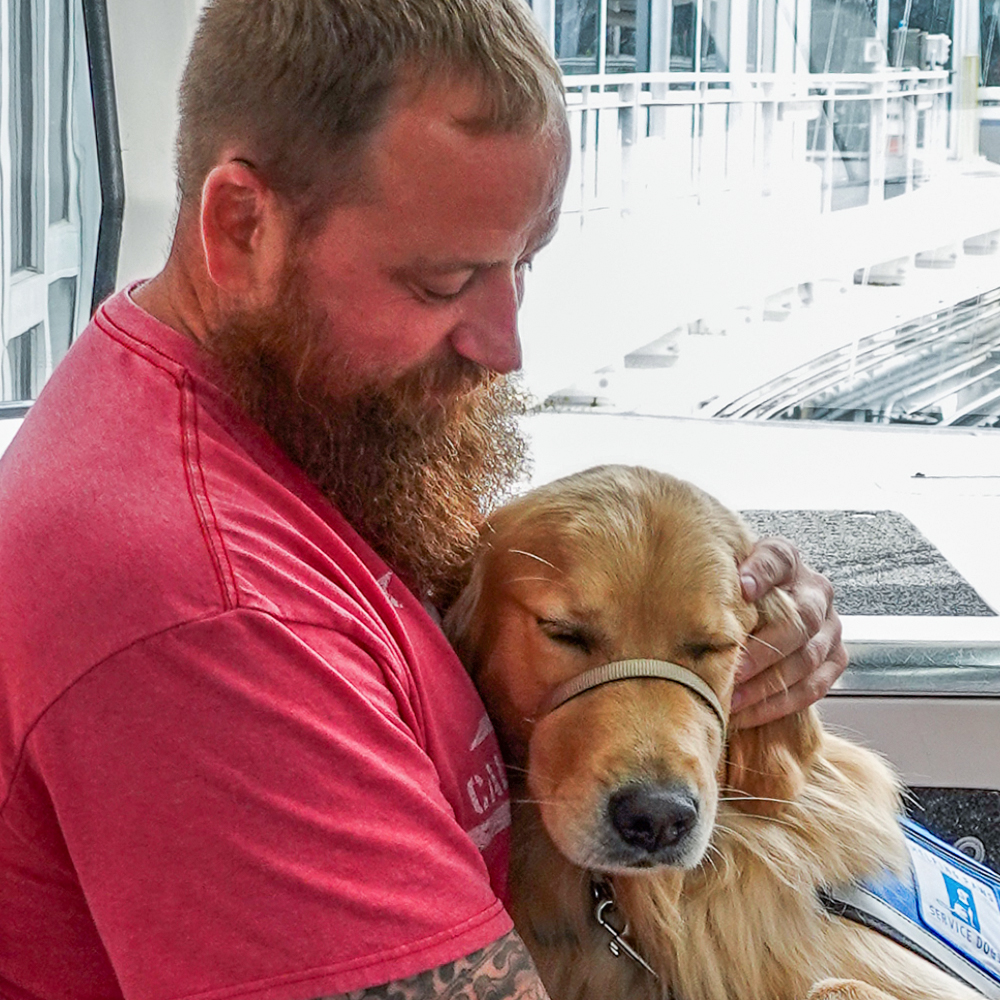 Helping Paws – Kurtis and Service Dog Malkin